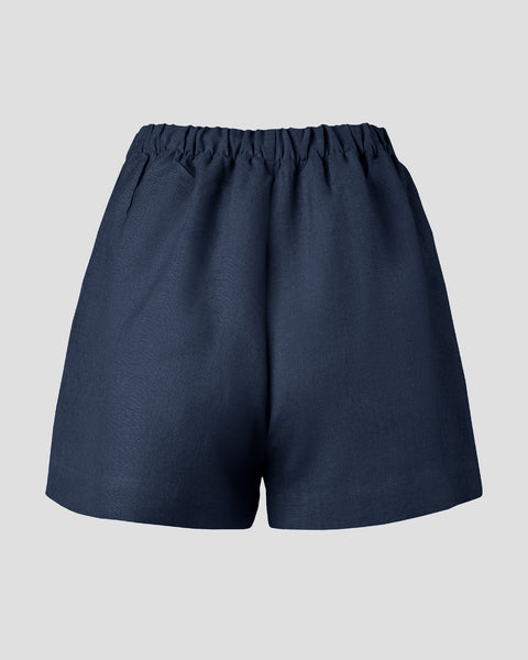 Packshot showing the back of shorts in the color storm blue.