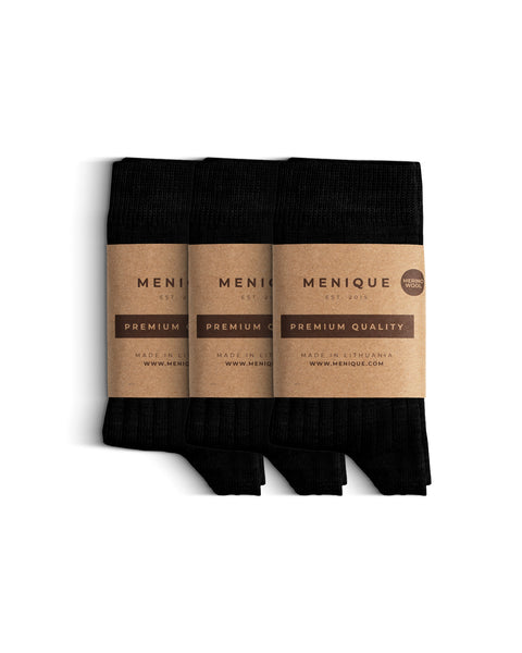 A 3-pack of kids' black ribbed merino wool socks with “Menique Premium Quality” labels.
