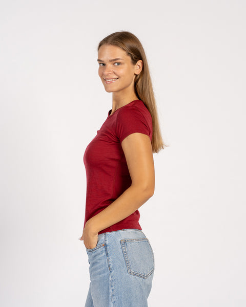 Side view of model wearing royal cherry Merino T-shirt – soft lightweight wool tee
