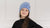 a girl wearing light blue knitted merino wool beanie