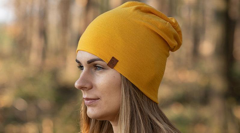 Woman weearing yellow beanie hat from merino wool