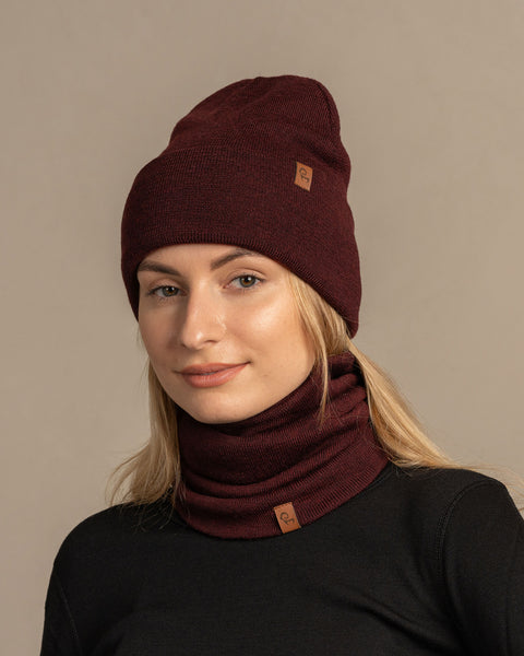 Women wearing knitted merino wool beanie and gaiter in royal cherry
