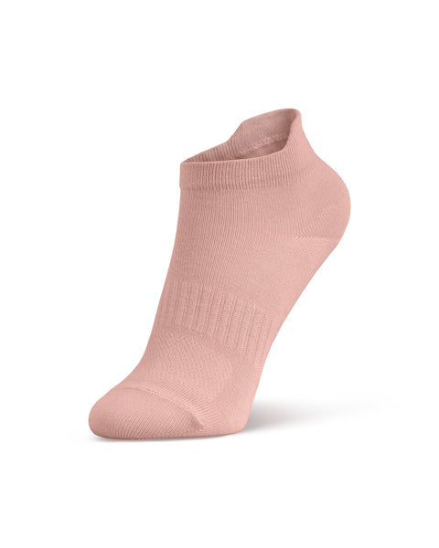 A product shot of a single light pink ankle sock, filled out to display its shape as if worn on a foot, standing upright at an angle against a white background.