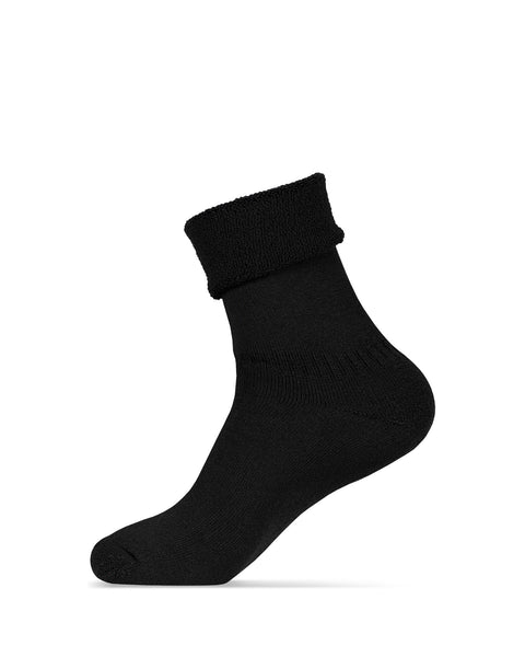 The menique women&#39;s merino lined sherpa socks in color black, in a white background, with the sock cuffed from a side view.