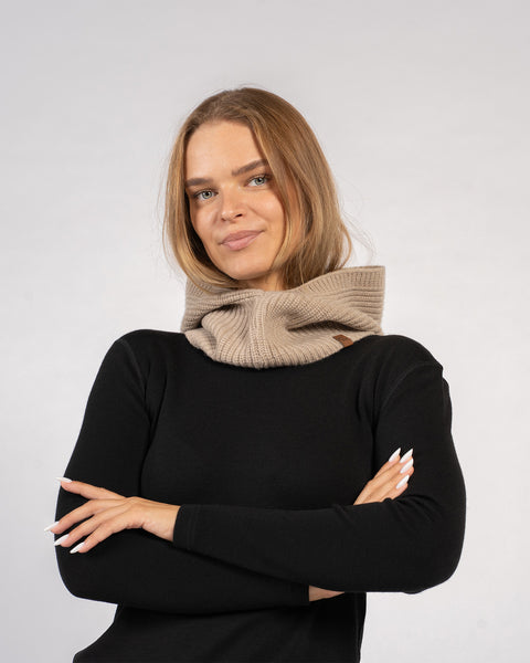 Woman wearing knitted cashmere blend ribbed hood balaclava in creamy beige – cozy winter accessory