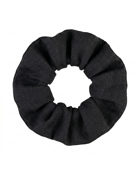 A top-down product shot of a black fabric hair scrunchie isolated against a pure white background. The fabric is gathered and scrunched around an internal elastic.